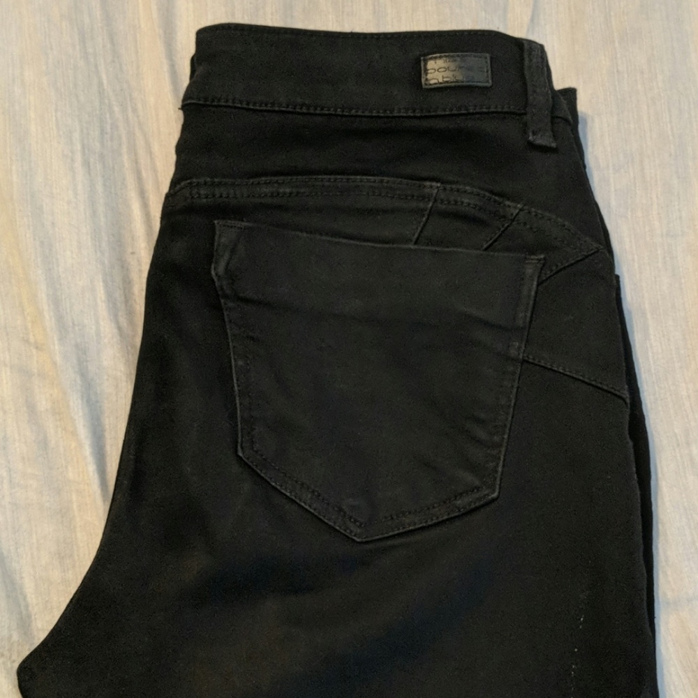 Black Miss poured in blue jeans